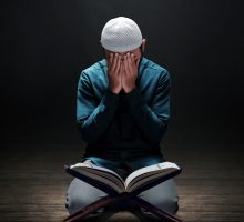 muslim man Quran sad face